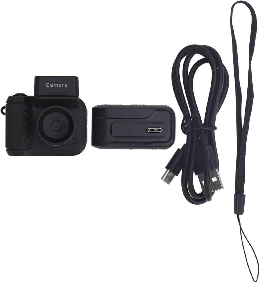 Rivoma portable 1080P keychain camera, retro design, on a wooden table with accessories
