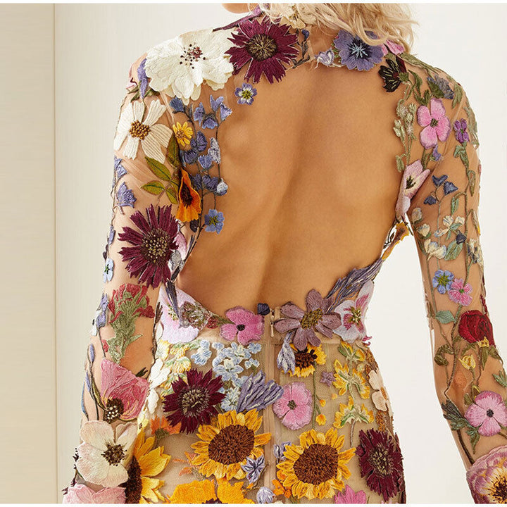 Elegant women's floral midi dress with a high neckline, ideal summer party wear or feminine special occasion attire.