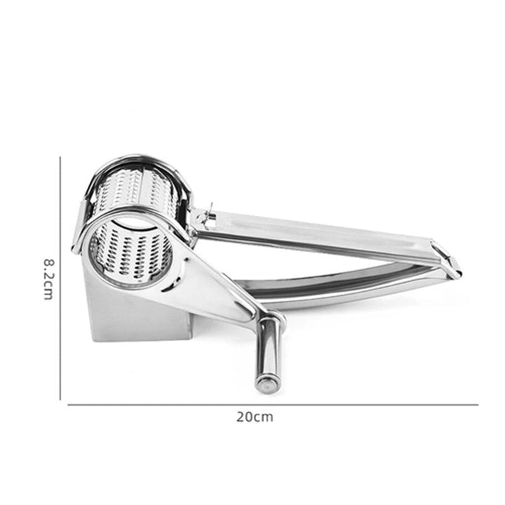 Hand operating a stainless steel rotary grater, shredding cheese for a meal. Effortless kitchen prep tool.