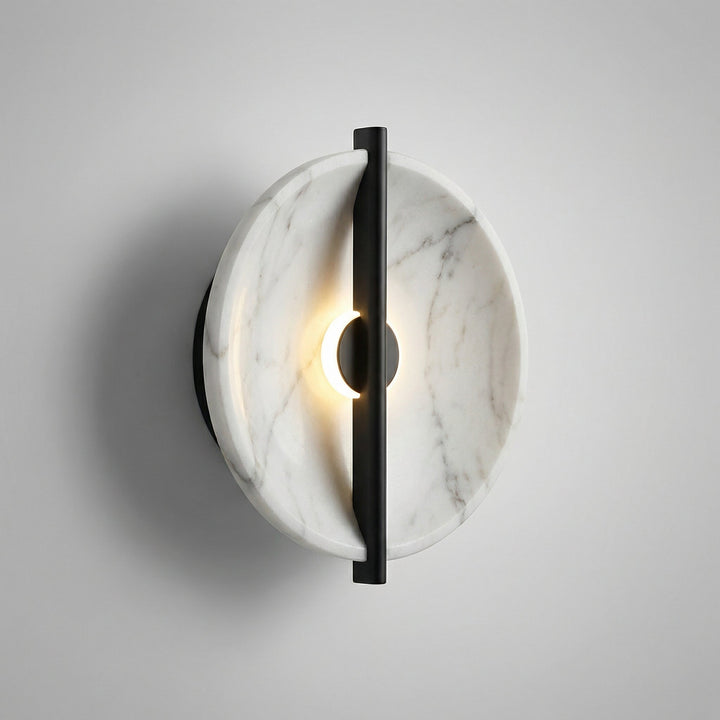 Elegant round resin wall sconce with marble effect, warm LED light for interior design.