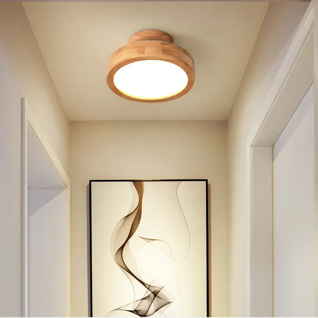 Round wooden Scandinavian ceiling light for modern homes, perfect for minimalist decor.