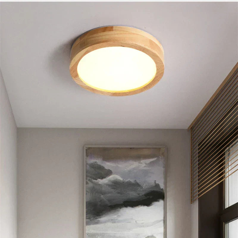 Elegant round wooden ceiling lamp, offering a modern, minimalist aesthetic for contemporary spaces.