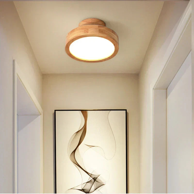 Stylish round wooden LED ceiling light, enhancing modern home decor with soft, ambient illumination.
