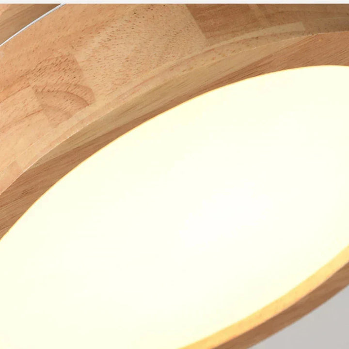 Smooth wooden round ceiling fixture, a modern Scandinavian LED lamp for clean, crisp home lighting.