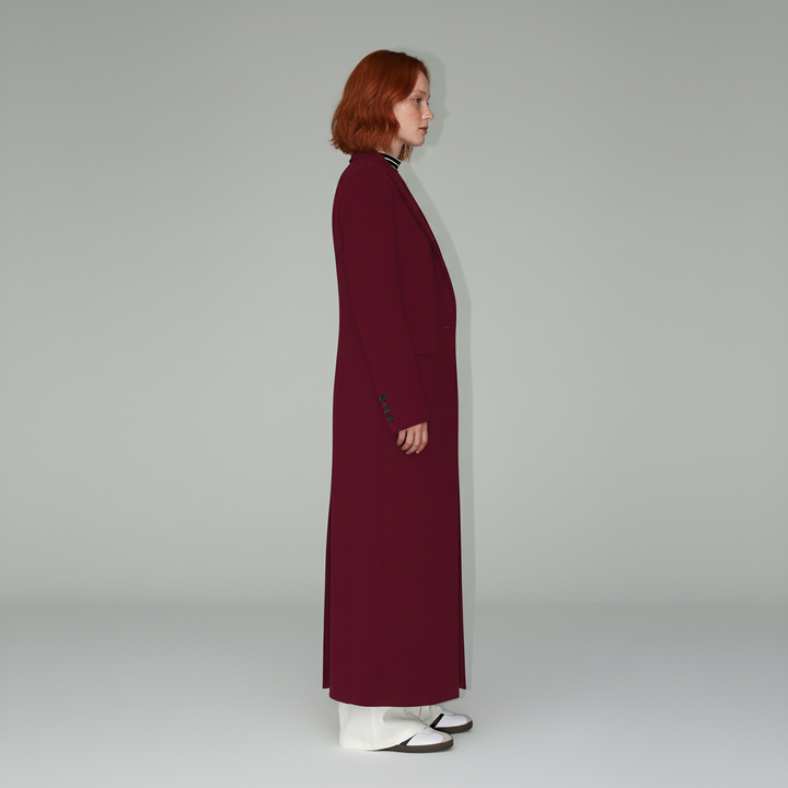 Detailed view of a ruby women's tailored long coat, highlighting its elegant fit and modern design.