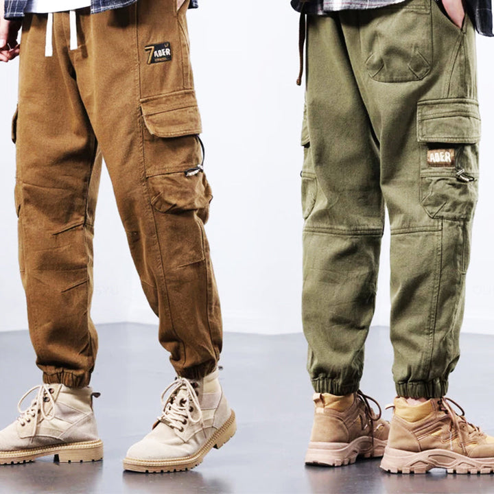 Rugged men's cargo pants, durable & versatile for outdoor adventures or casual everyday style, with multi-pockets.