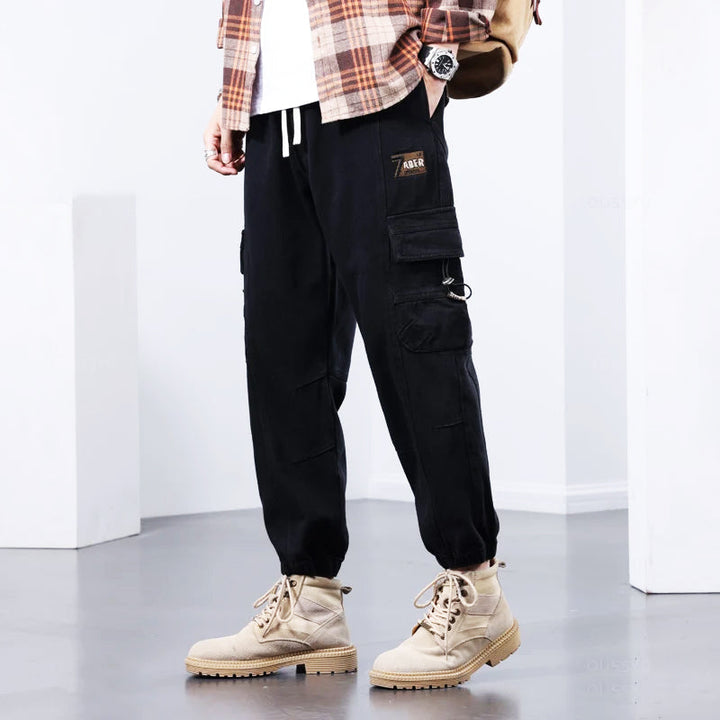 Stylish men's utility cargo pants, comfortable for everyday wear, featuring ample pockets for practicality.