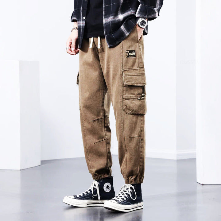 Durable men's workwear cargo pants, rugged & versatile, ideal for outdoor activities & tough tasks.