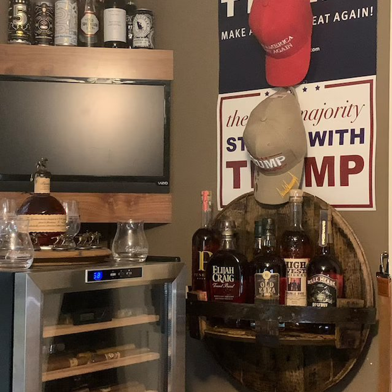Rustic whiskey shelf made from a bourbon barrel, a unique gift for him and stylish wall decor.