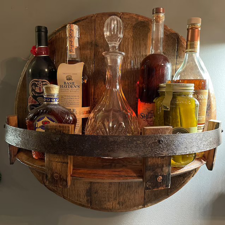 Oak bourbon barrel shelf with metal accents, perfect for displaying whiskey bottles and rustic home decor.