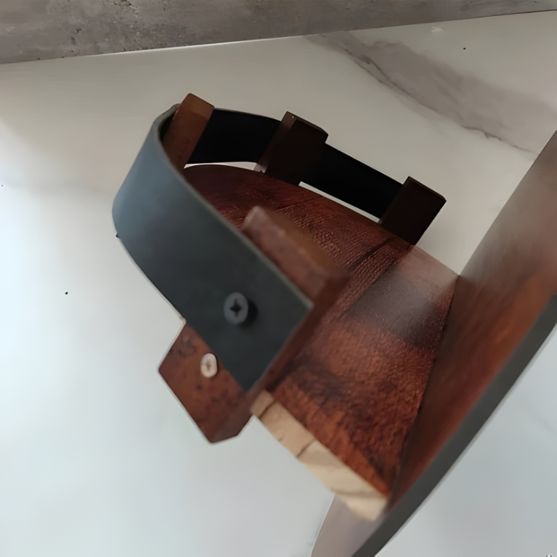 Unique reclaimed wood barrel shelf for organizing & displaying bourbon & whiskey bottles in a rustic bar.