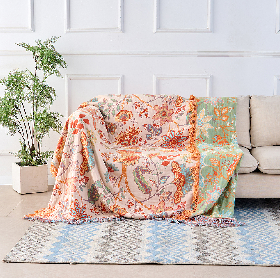 Rustic floral cotton boho throw blanket, perfect for cozying up or bohemian home decor.