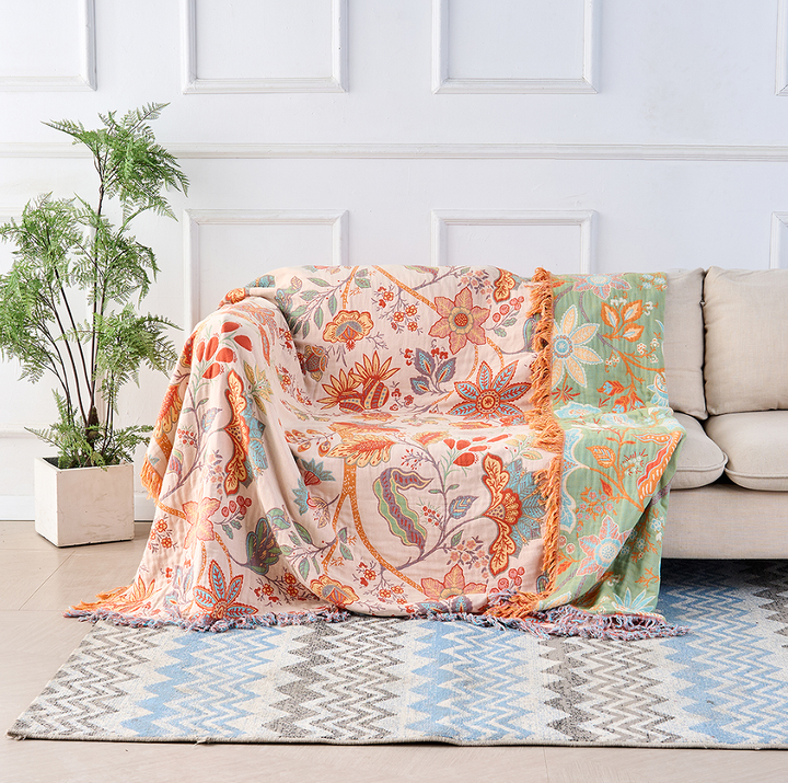 Rustic floral cotton boho throw blanket, perfect for cozying up or bohemian home decor.