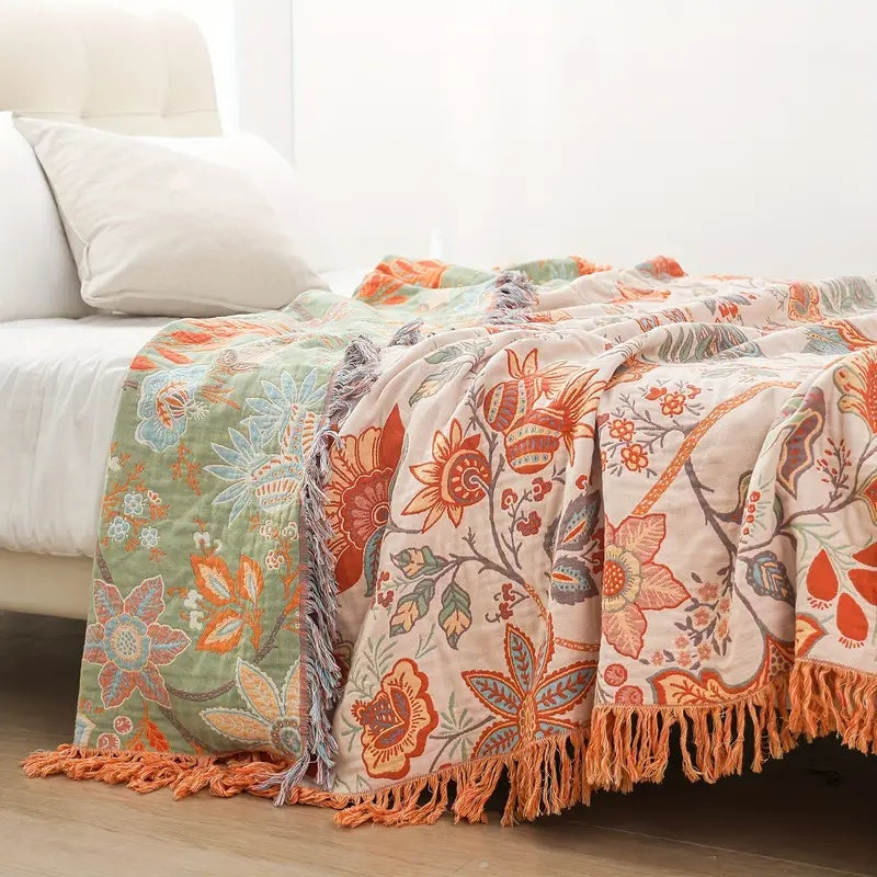 Soft cotton boho throw with a beautiful rustic floral pattern, ideal for any cozy living space.
