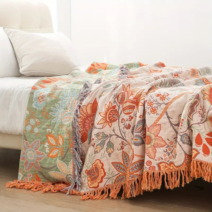 Soft cotton boho throw with a beautiful rustic floral pattern, ideal for any cozy living space.