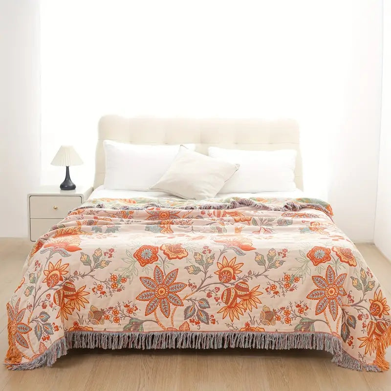 Boho floral cotton blanket featuring a rustic design, excellent for adding warmth and style.