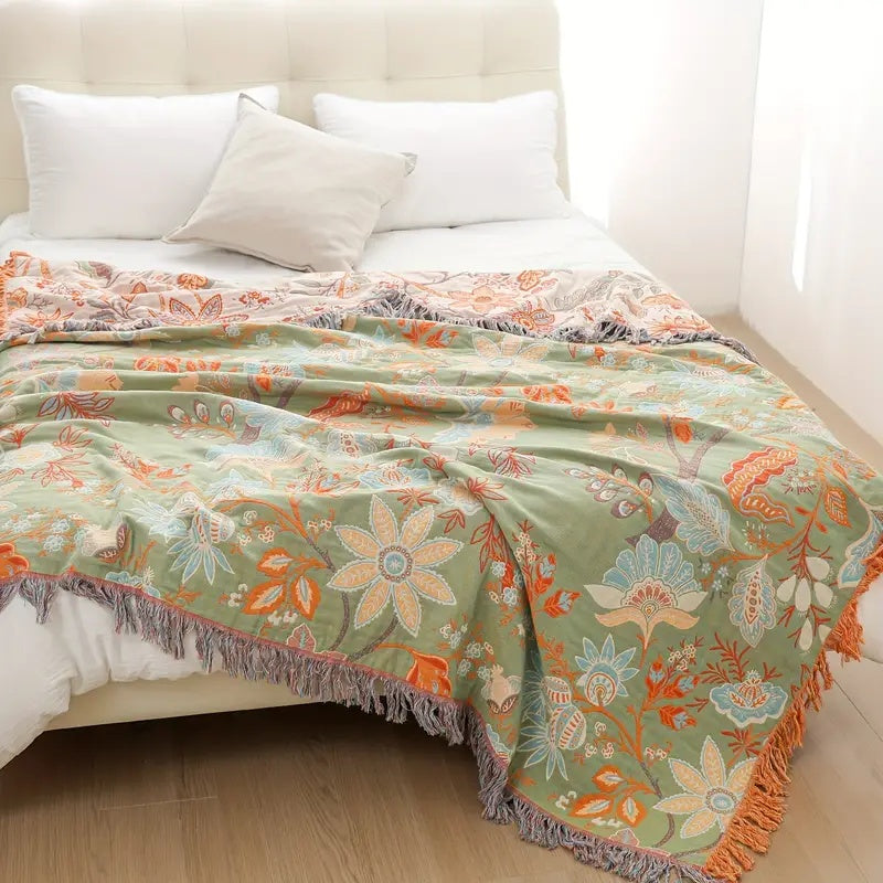 Stylish unisex cotton floral throw blanket, a versatile and soft addition to rustic interior design.
