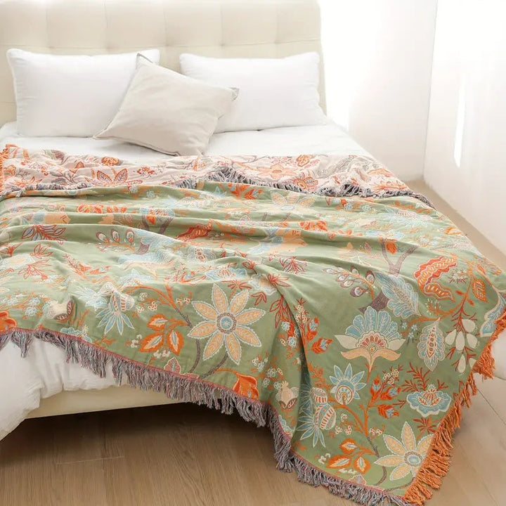 Stylish unisex cotton floral throw blanket, a versatile and soft addition to rustic interior design.