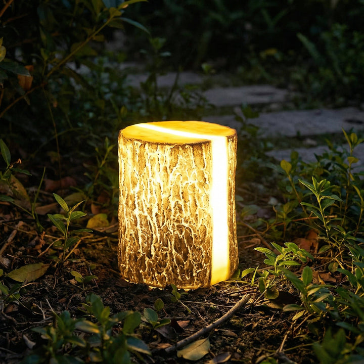Weatherproof LED garden light, tree stump design. Energy-efficient landscape lamp for patios.