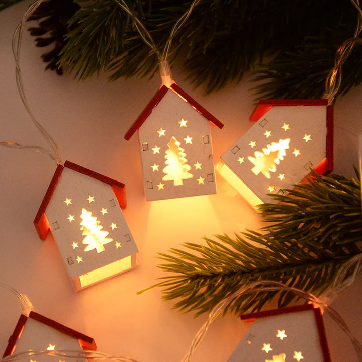 Rustic wooden Christmas house with warm LED lights. Perfect holiday decor for your home.