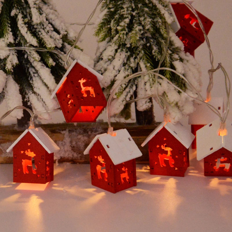 GlowHouse wooden Christmas houses, each with LED lights. Beautiful rustic festive lighting.