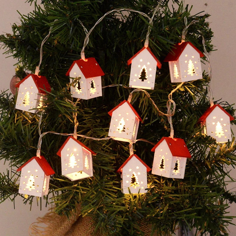 GlowHouse set of wooden Christmas houses with battery-operated LED lights. Festive winter decor.