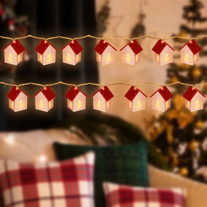 Charming wooden Christmas village houses featuring bright LED festive lighting. Ideal seasonal ornament.