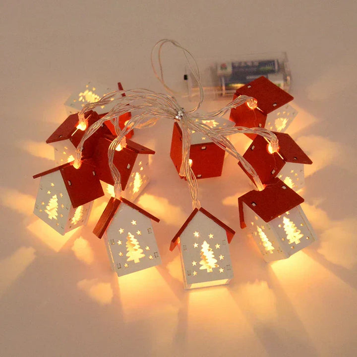 Decorative wooden Christmas house with LED lights, a cozy addition to your holiday home decor.