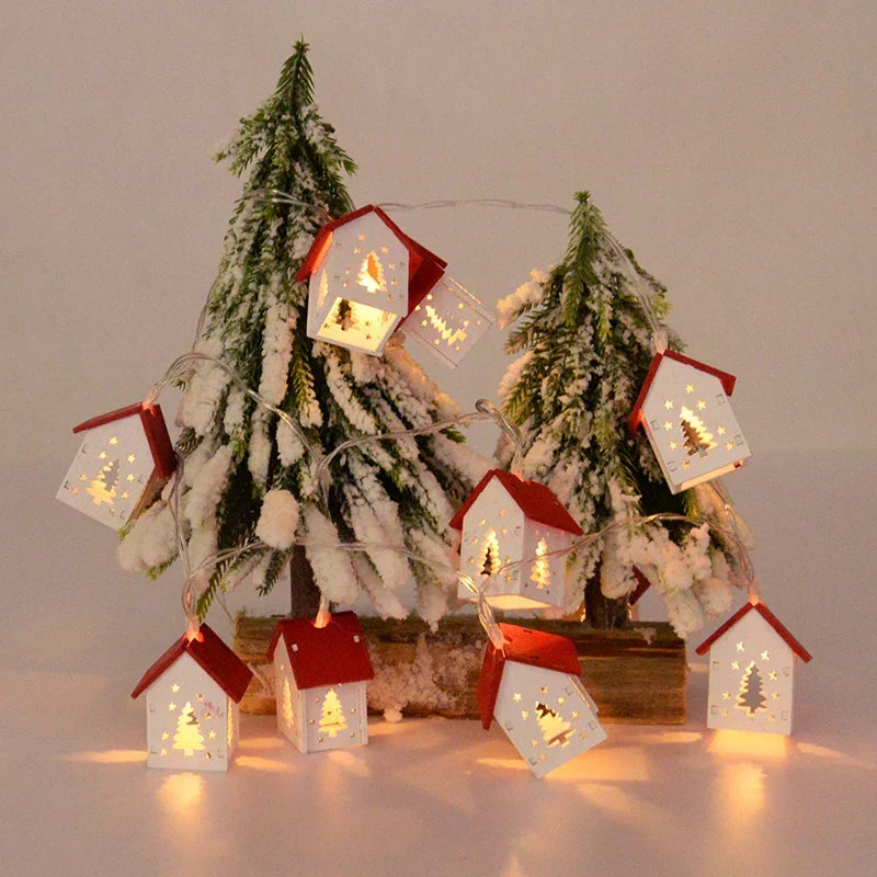 Battery-operated wooden Christmas house with LED illumination. A rustic touch for winter decor.