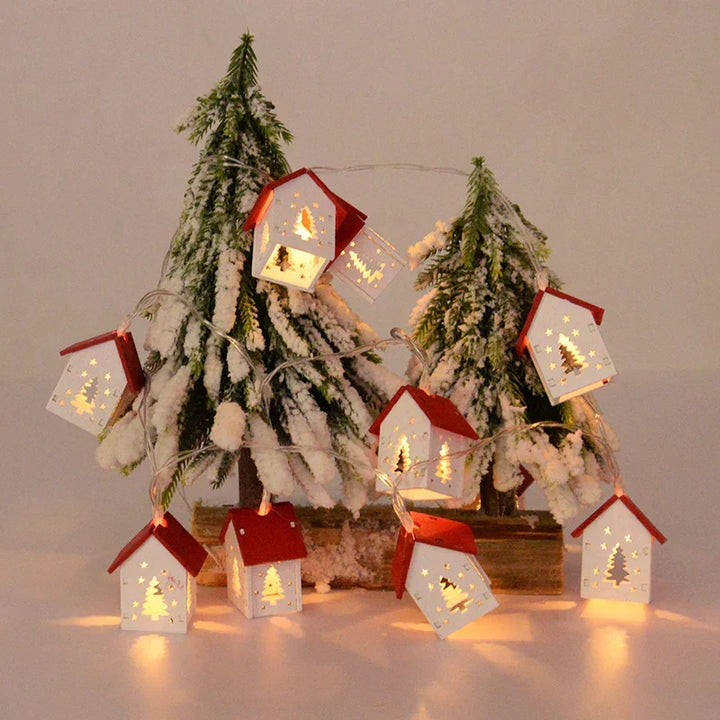 Battery-operated wooden Christmas house with LED illumination. A rustic touch for winter decor.