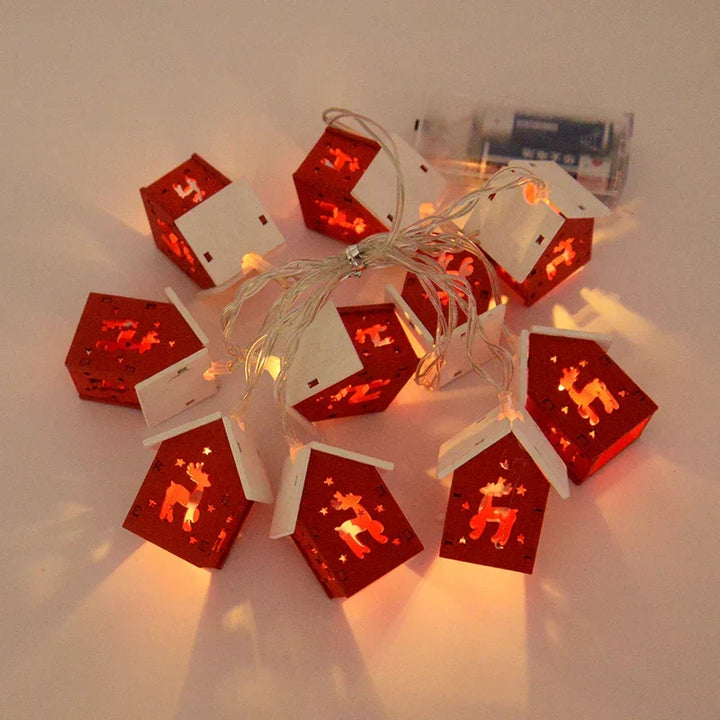 GlowHouse wooden Christmas houses with LED lights, adding a warm glow to your Christmas tree.