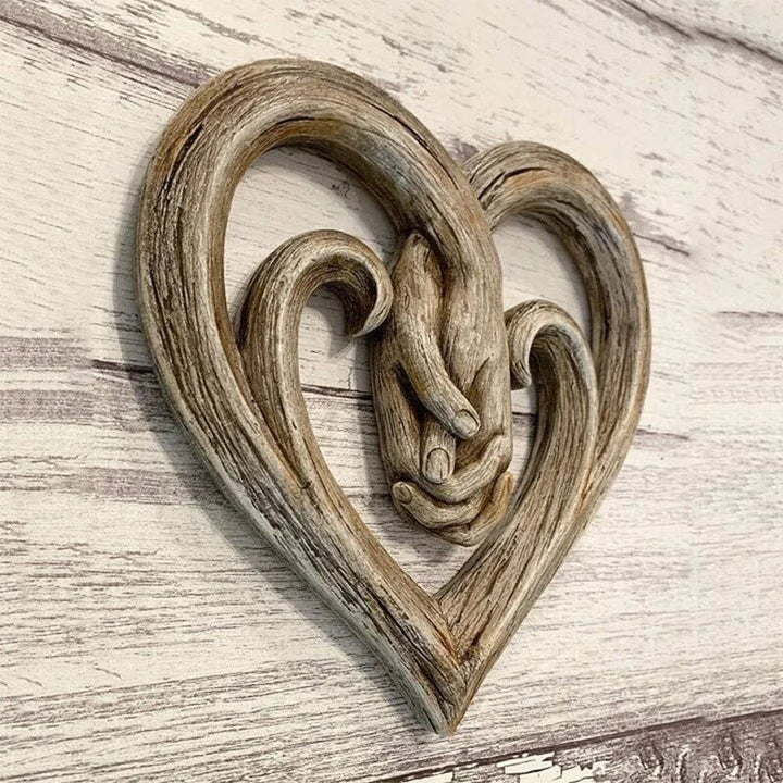 Elegant wooden heart hands wall art, eternal love decor for home. Natural wood finish, romantic couples gift or accent.
