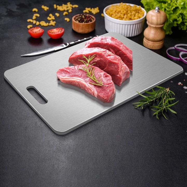 Durable stainless steel cutting board with non-slip base for secure chopping. Ideal for busy kitchen cooking.