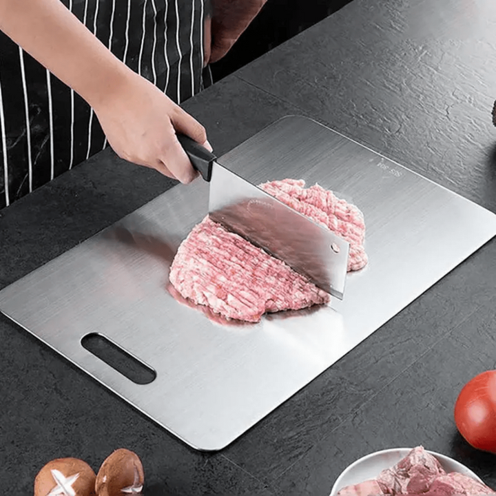 Close-up of the brushed stainless steel cutting board surface, highlighting its rustproof and durable quality.