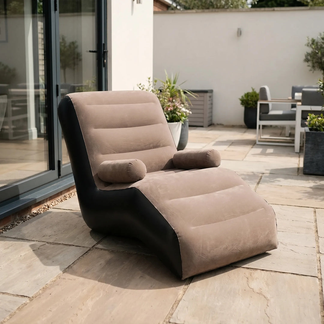 S-shaped inflatable lounger provides ergonomic comfort. Portable outdoor/indoor chaise for ultimate relaxation.