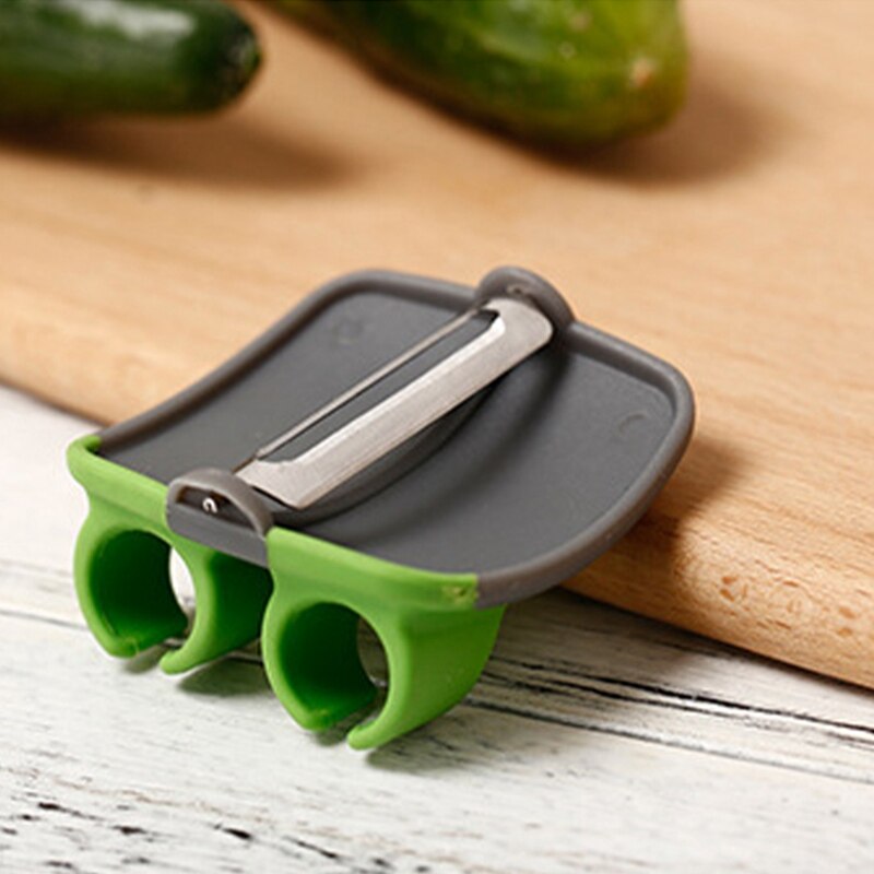 Kitchen protective vegetable peeler with finger guard, designed for safe and easy peeling of fruits & veggies.