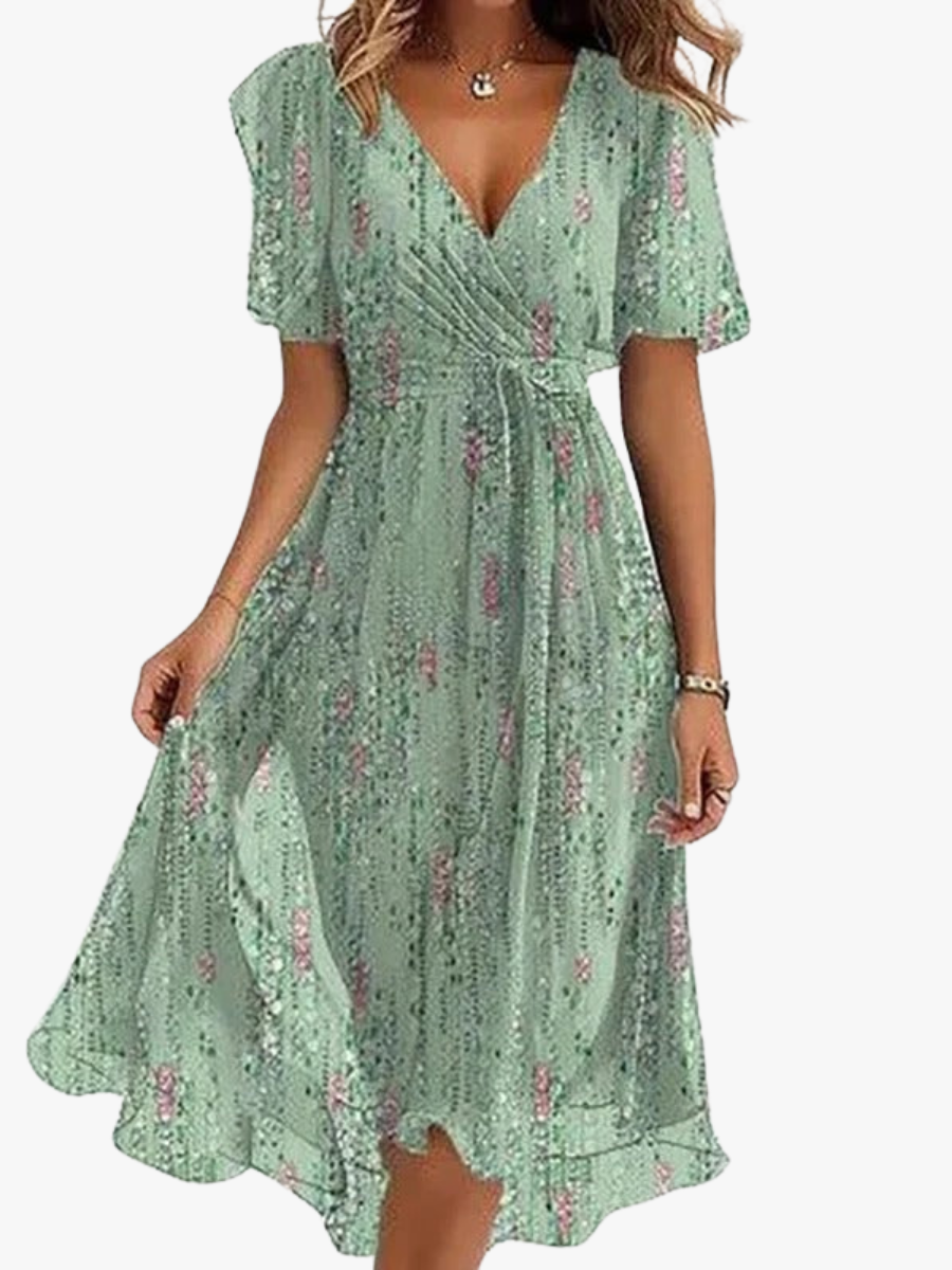 Sage green women's wrap V-neck midi dress, flutter sleeves, flowy ruffle hem. Elegant summer style.