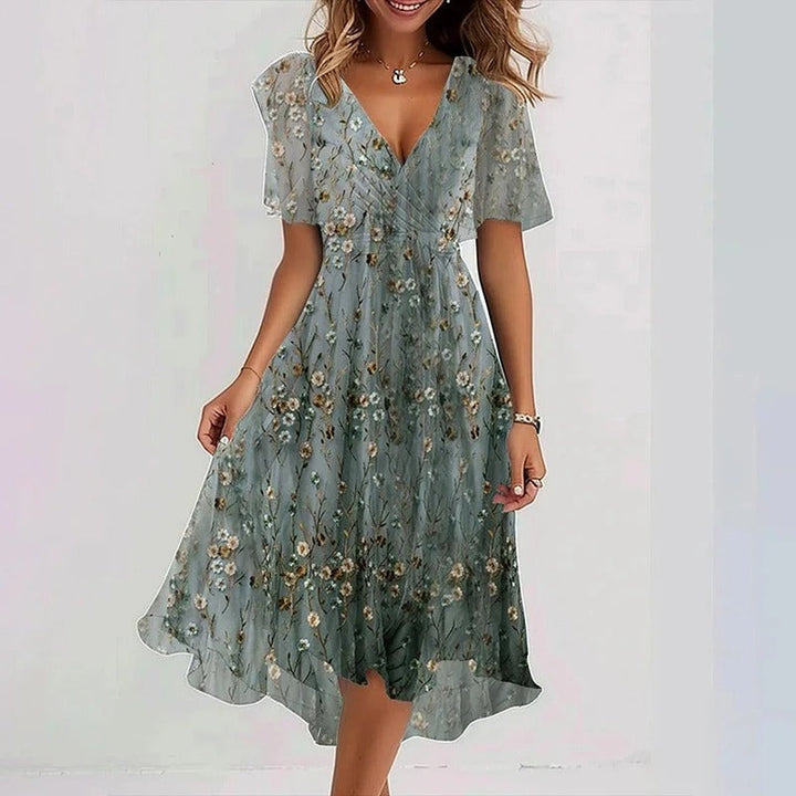 Floral print V-neck wrap midi dress for women, with flattering flutter sleeves and a delicate ruffle hem.