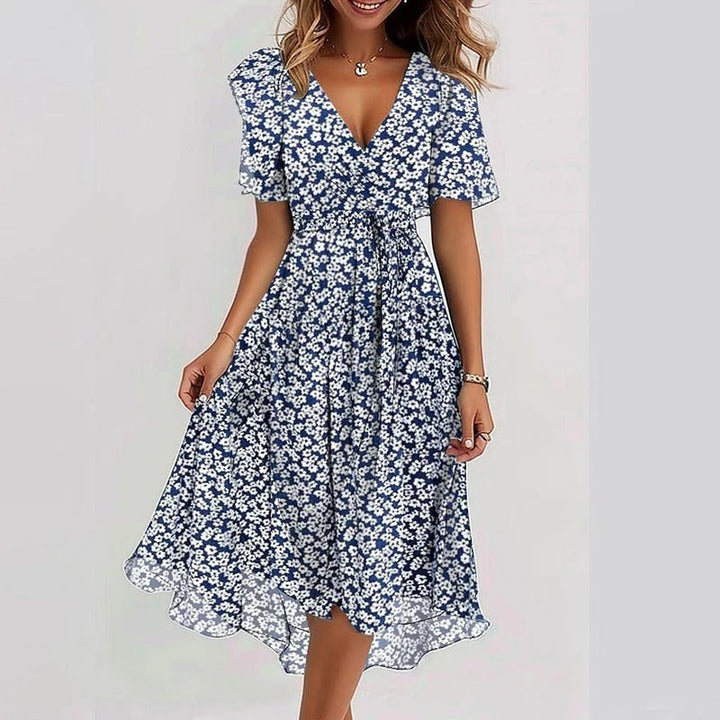 Women's V-neck wrap midi dress in sage green, delicate flutter sleeves & flowy ruffle hem. Perfect for summer.