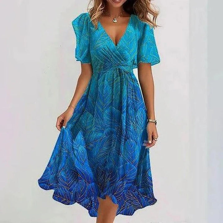 Elegant floral print women's wrap V-neck midi dress with charming flutter sleeves & a flowing hem.