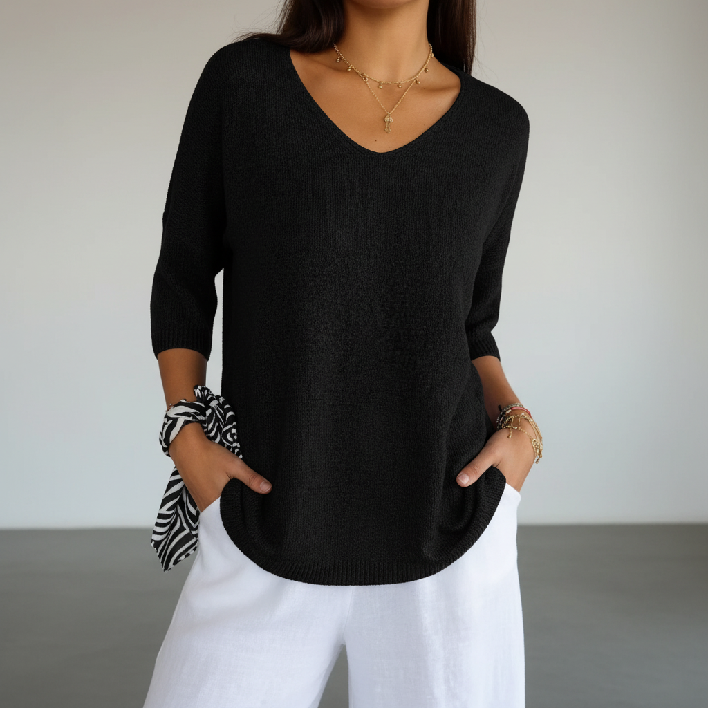 Sapphira V-neck knit top paired with jeans, demonstrating a chic casual summer outfit