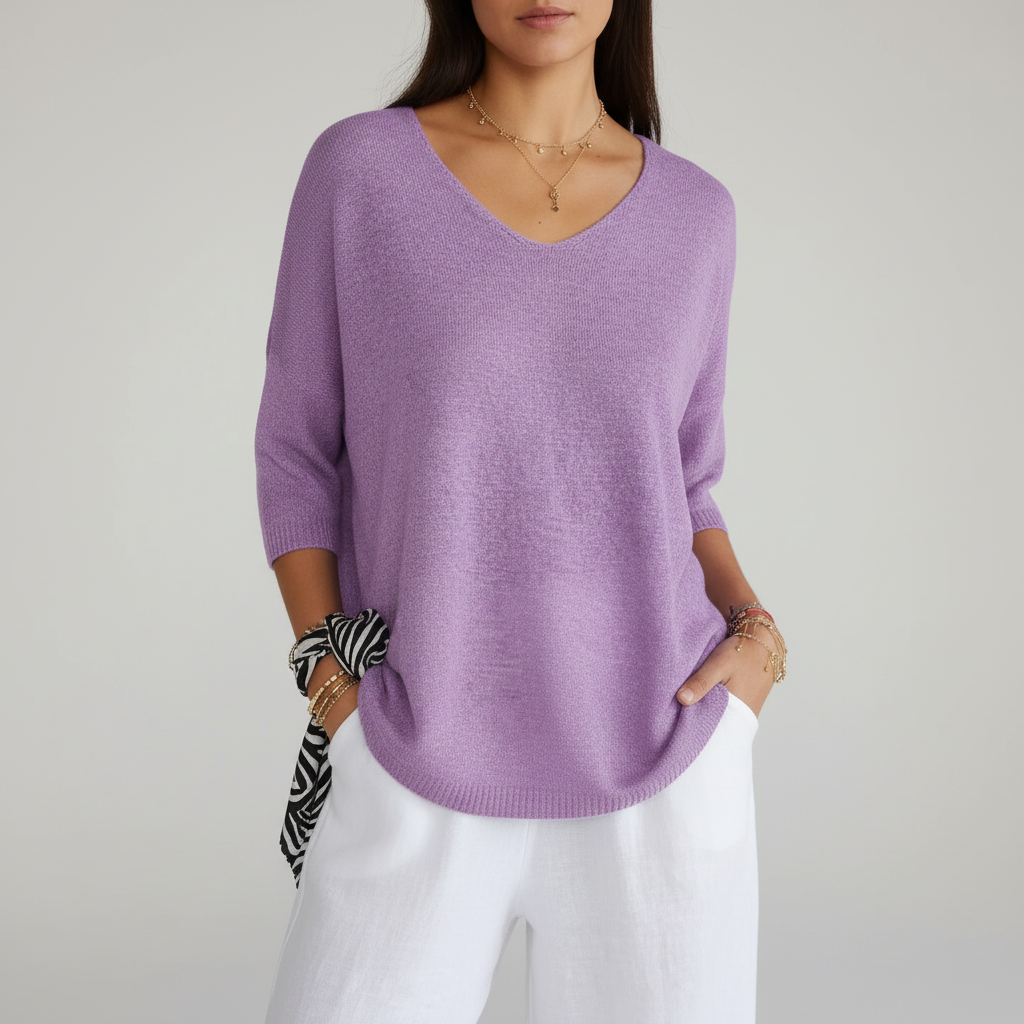 Folded Sapphira lightweight V-neck knit top, showcasing its soft cotton blend material