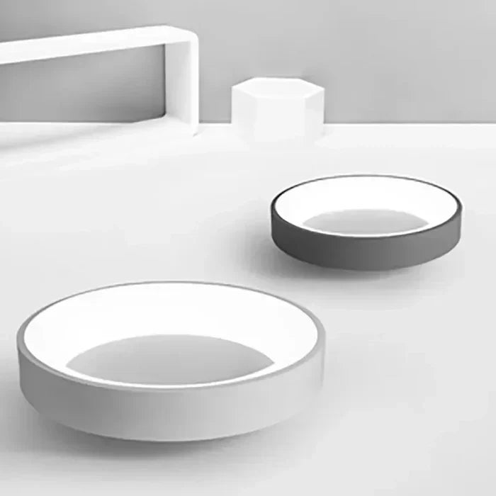 Minimalist Scandinavian round LED ceiling light, energy-efficient for bedroom or living room ambient lighting.