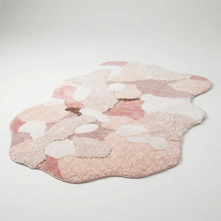 Flowique sculpted floral area rug. Soft, nature-inspired pastel rug with organic wave design for home decor.