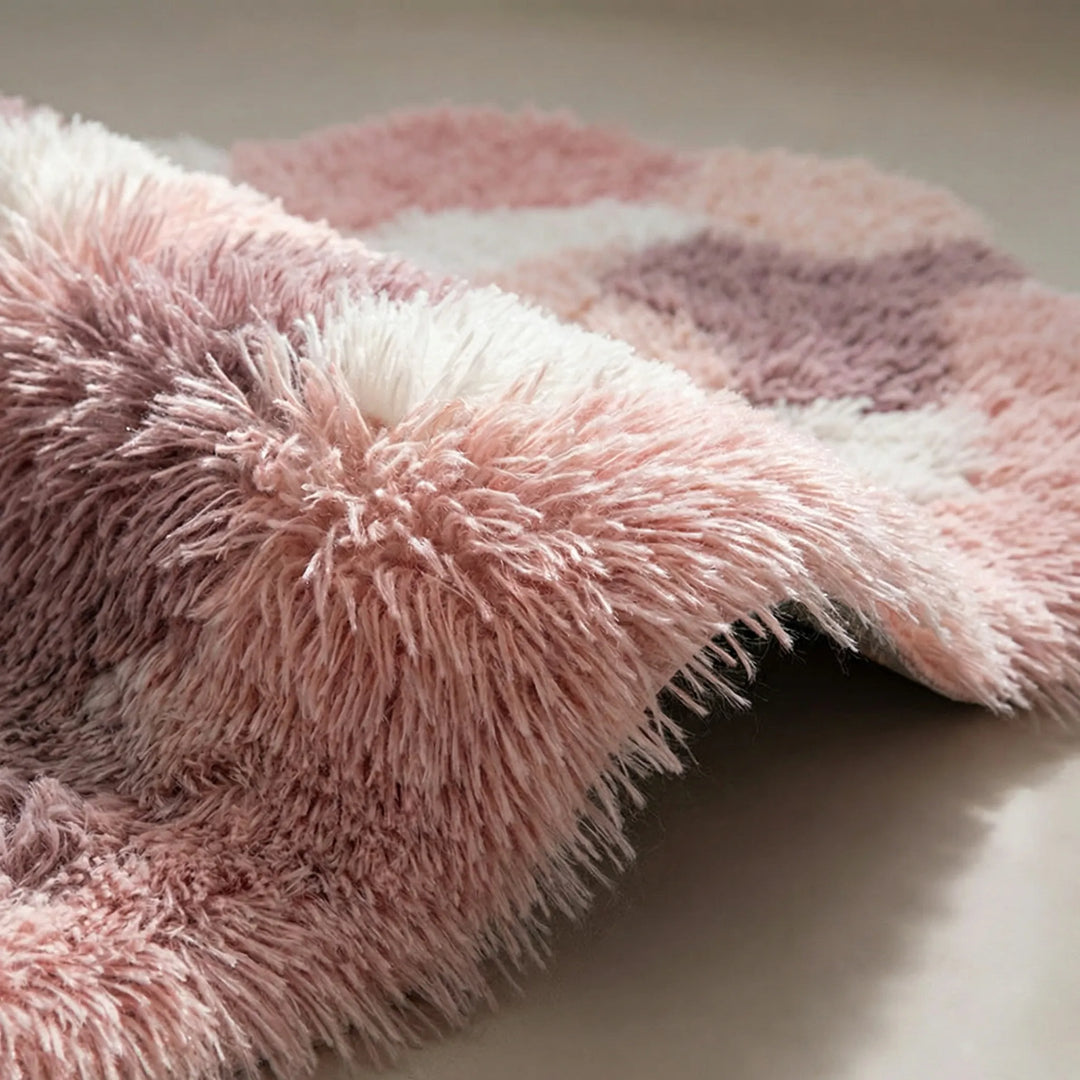 Beautiful sculpted floral area rug with soft pastel colors and organic wave design, ideal for bedroom or living room.