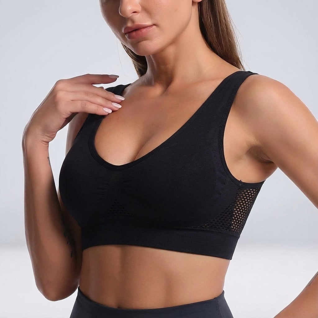 Activewear seamless sports bra for women, features breathable mesh and comfortable padding.