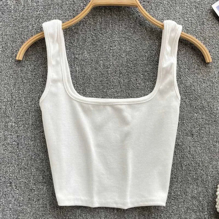 Solid color seamless cropped tank top for women with an open back, comfortable stretch fabric.