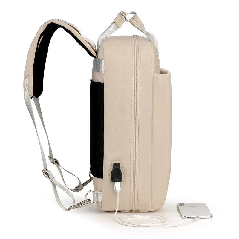 Side view of grey anti-theft backpack highlighting slim profile and secure, easy-access compartments.