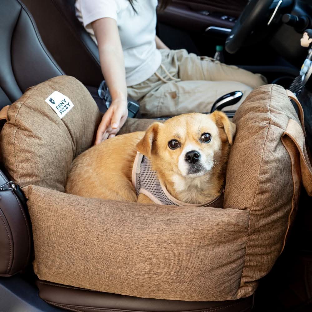 Comfortable pet booster seat for cars, washable cover; secure dog travel bed, non-slip design.