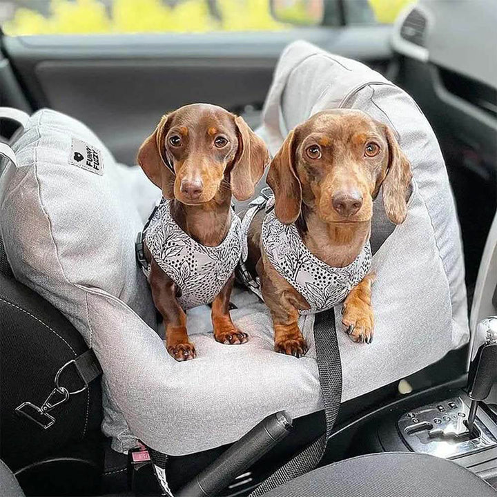 Comfortable pet travel bed and dog car seat booster; washable, secure, ensuring a safe ride.